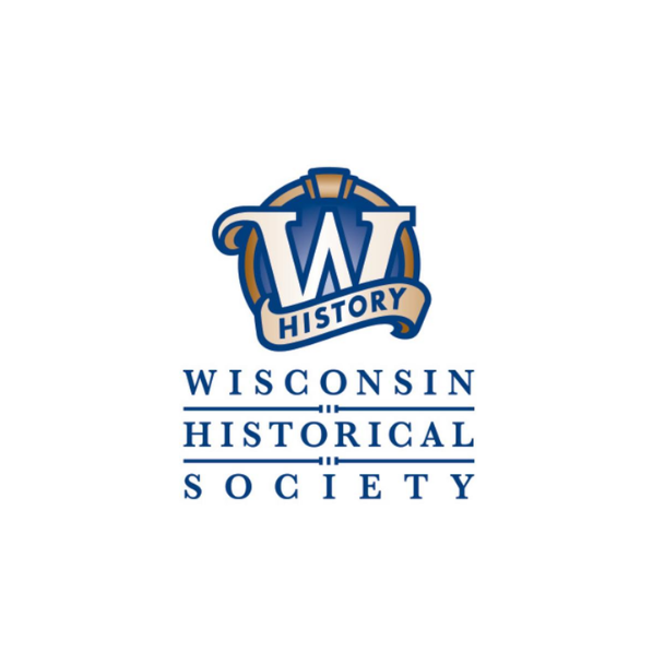 Two of the three mitchell park glass domes are lit up in blues, purples, and reds at night.
